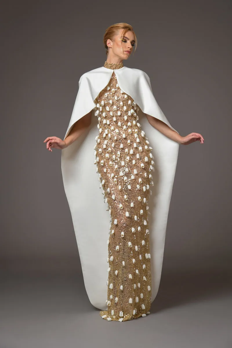 Embellished gold halter neck dress adorned with dangling cocoons paired with a Duchesse satin cape